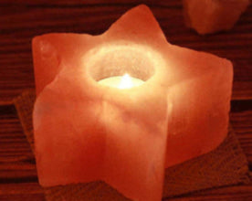 Portavelas de sal del Himalaya en forma de estrella encendido, ideal para decoración feng shui